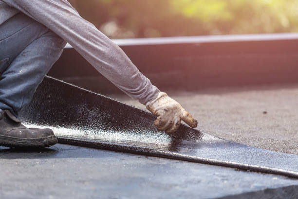 Professional Basement Waterproofing technician working in Hampton, VA